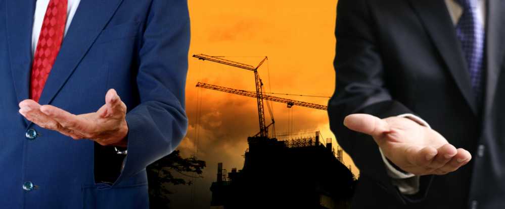 twee mannen in pakken steken hand uit| DID-online.nl